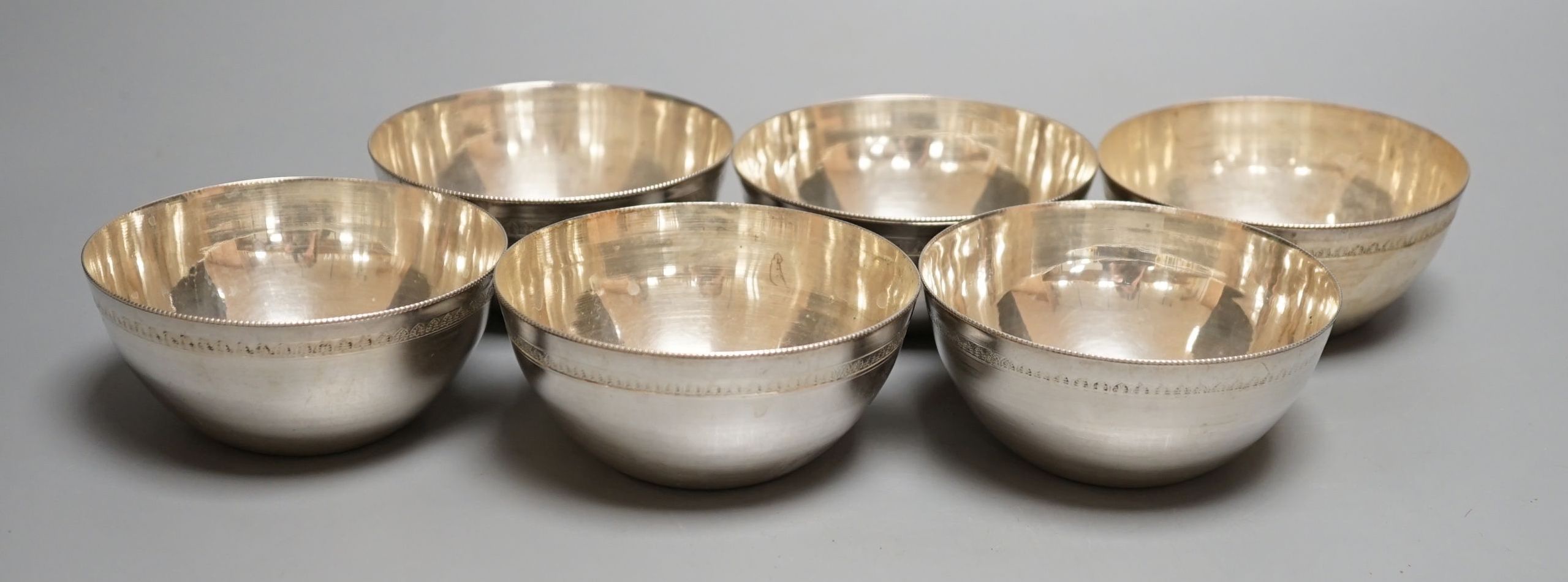 A set of six 20th century Egyptian white metal finger bowls, 10.3cm, 17.5oz.